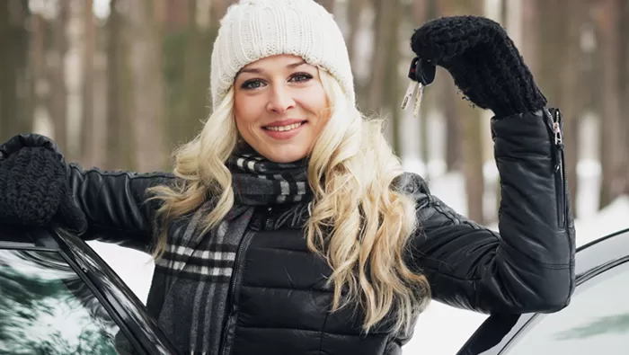 woman in winter with new car