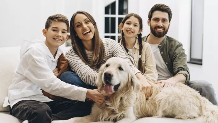 family together on couch smiling
