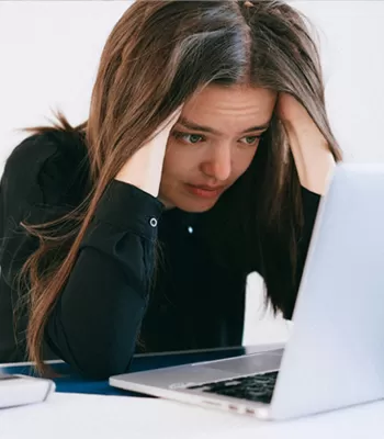 woman stressed out reviewing finances