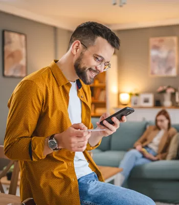 man using credit card to shop