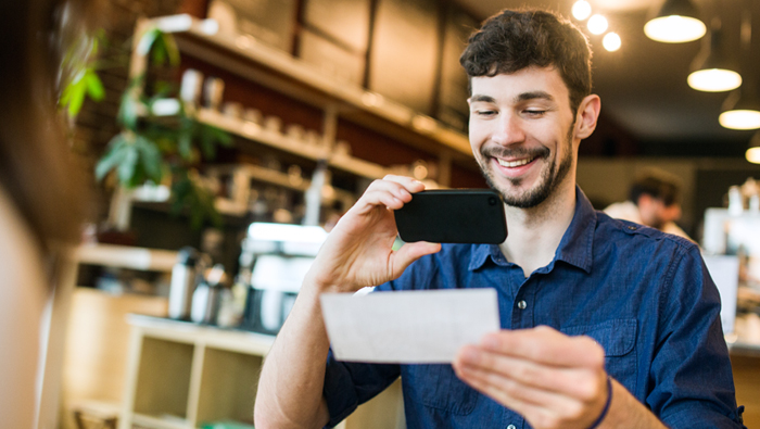 male depositing a check with his phone