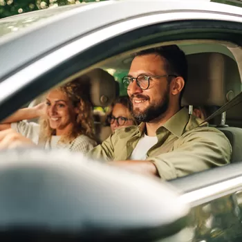 happy family driving in car