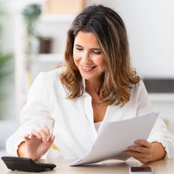 woman calculating monthly bills