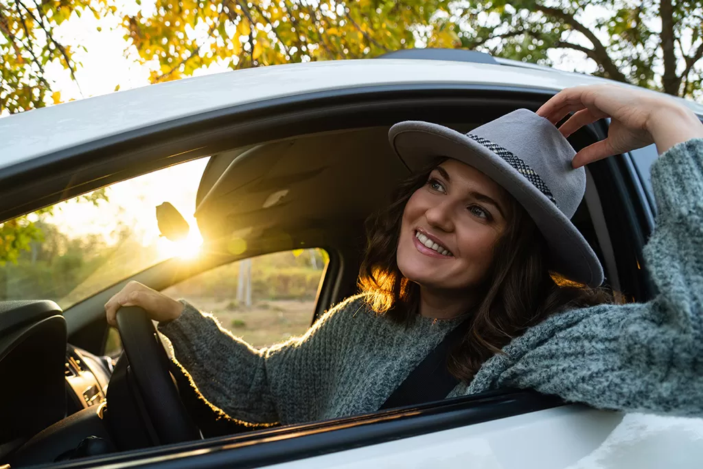 happy couple driving car